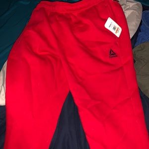 Red Reebok sweat pants
